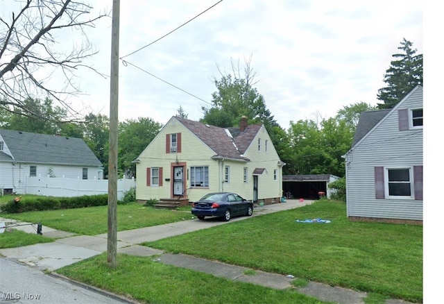 bungalow-style house featuring a front yard