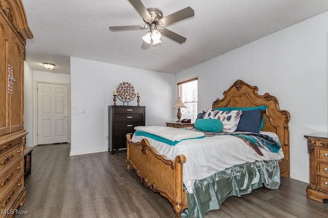 bedroom featuring ceiling fan, baseboards, and dark wood finished floors