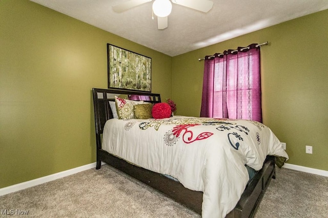 bedroom with carpet, a ceiling fan, and baseboards