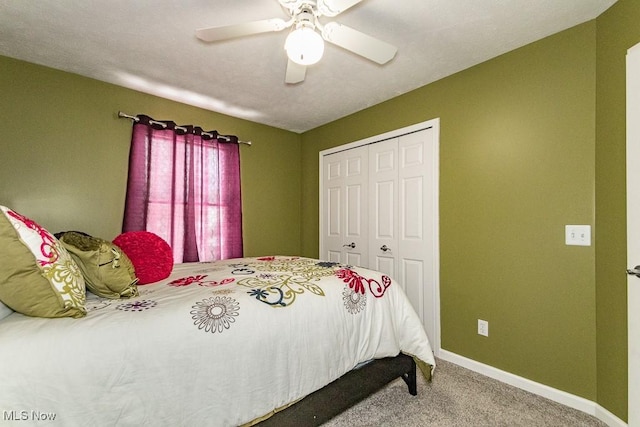 bedroom with ceiling fan, baseboards, a closet, and carpet flooring