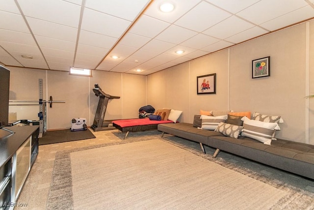 exercise room featuring carpet, a paneled ceiling, and recessed lighting