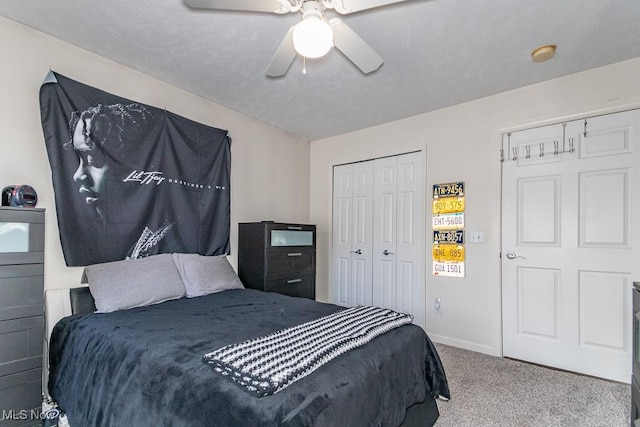 bedroom featuring baseboards, a ceiling fan, a textured ceiling, carpet flooring, and a closet