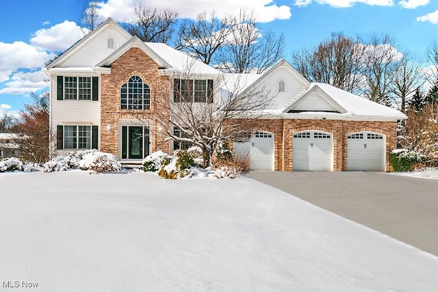 view of front of home featuring driveway and an attached garage