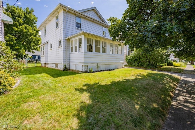 view of property exterior with a yard