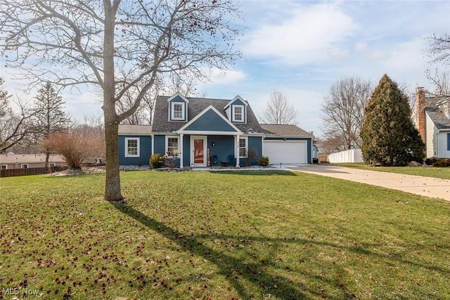 view of front of home featuring driveway, a front lawn, an attached garage, and fence