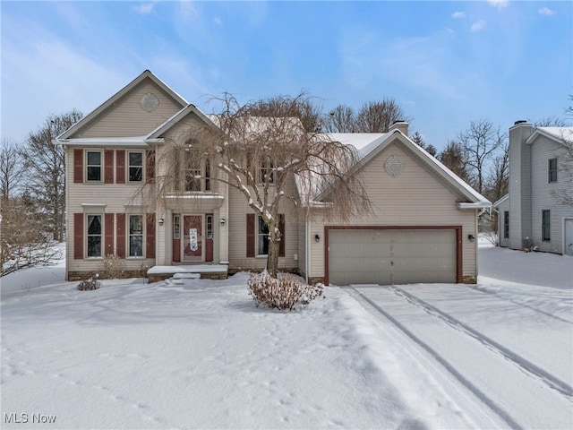 colonial home with an attached garage