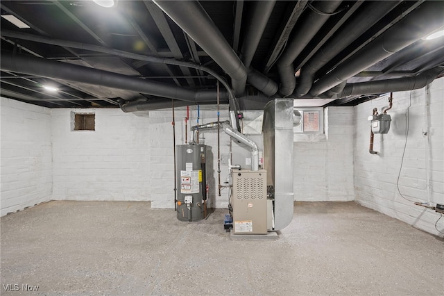 unfinished basement featuring water heater and heating unit
