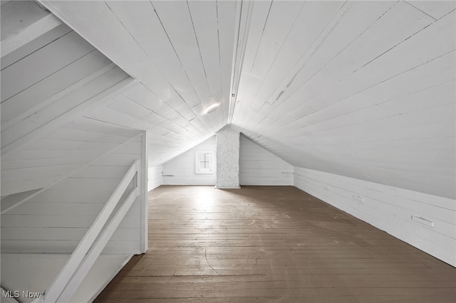 bonus room with lofted ceiling, wooden ceiling, wooden walls, and wood finished floors