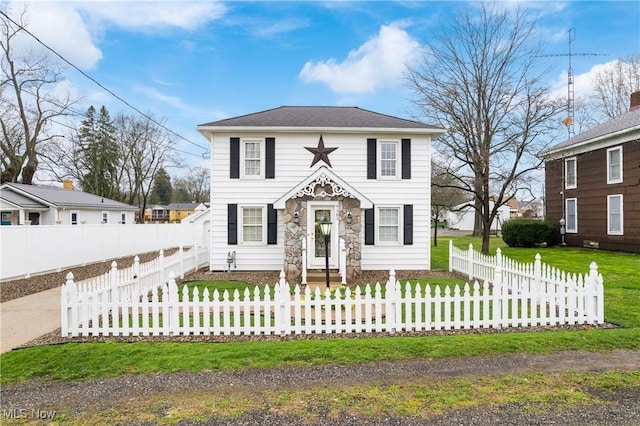 view of front of house featuring a fenced front yard and a front yard