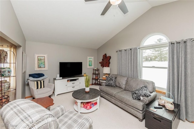 carpeted living area with lofted ceiling and ceiling fan