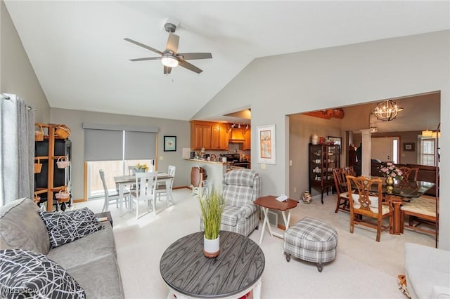 living area with lofted ceiling, decorative columns, light carpet, and ceiling fan with notable chandelier