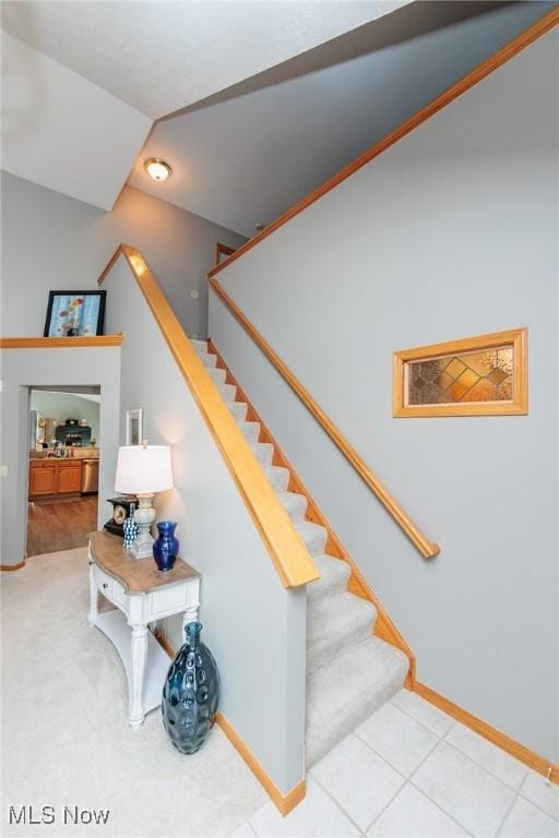 stairs featuring baseboards