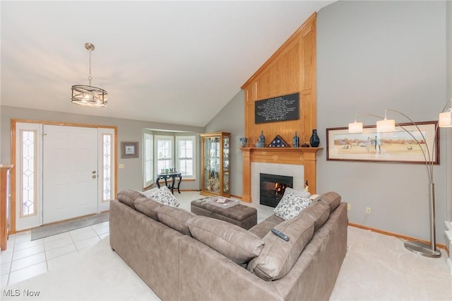 living area with light tile patterned floors, high vaulted ceiling, a fireplace, and baseboards