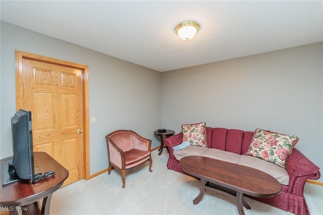 living room featuring carpet and baseboards