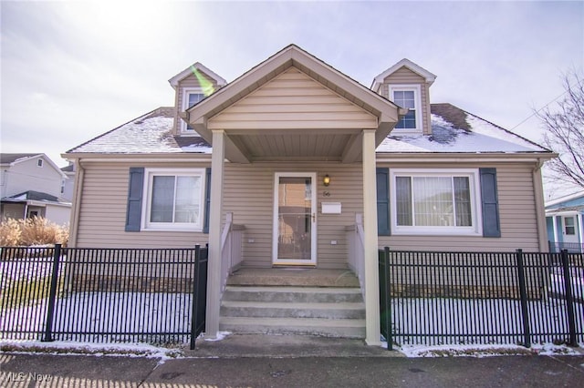 view of front of house with fence