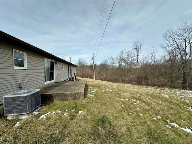 view of yard with a patio area and central air condition unit