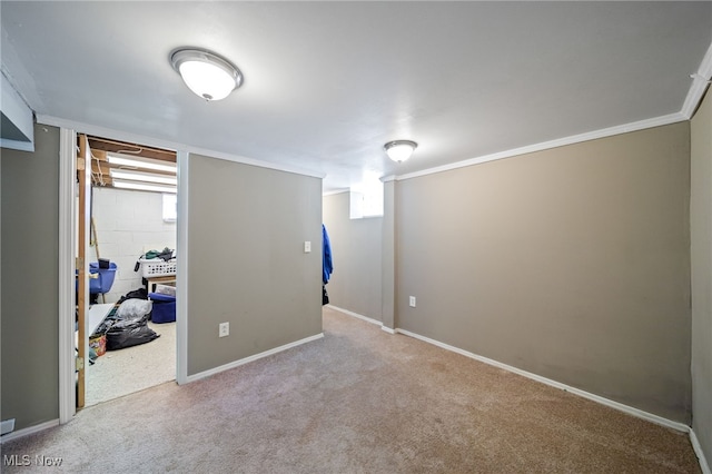 bedroom with baseboards, ornamental molding, and light colored carpet