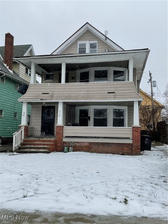 view of front facade with a porch and a balcony