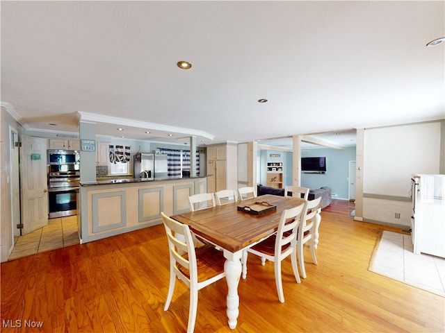 dining room featuring recessed lighting and light wood finished floors