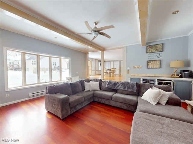 living area featuring ceiling fan, a baseboard radiator, dark wood-type flooring, ornamental molding, and beam ceiling