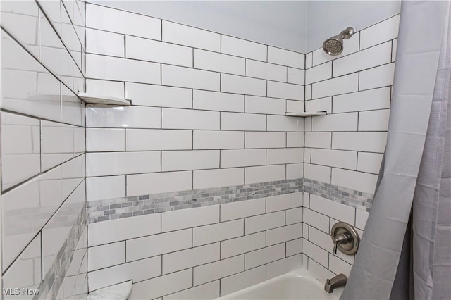 bathroom featuring shower / bath combo with shower curtain