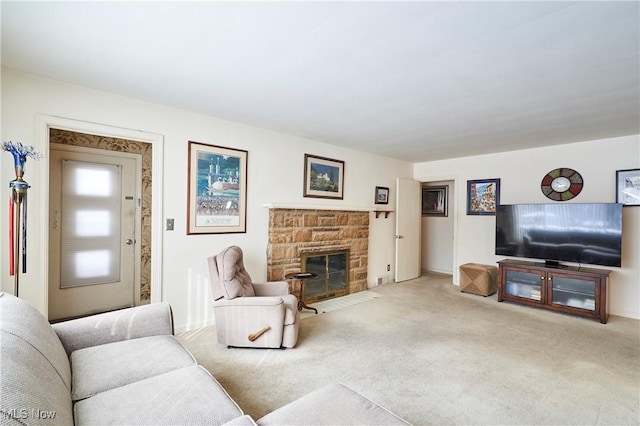 living room with a stone fireplace and light colored carpet