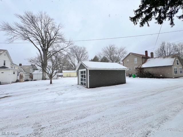 view of yard layered in snow