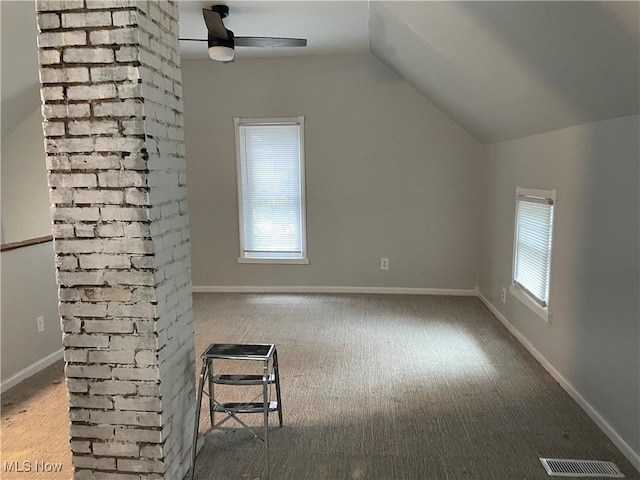 bonus room with carpet, visible vents, vaulted ceiling, and baseboards