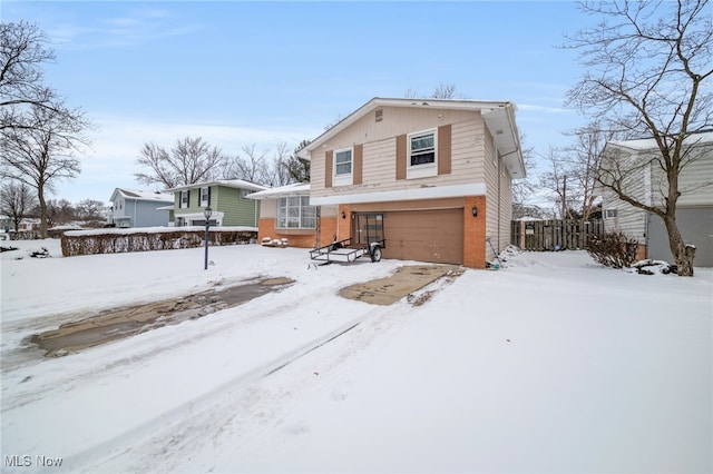 view of front of house featuring a garage and brick siding