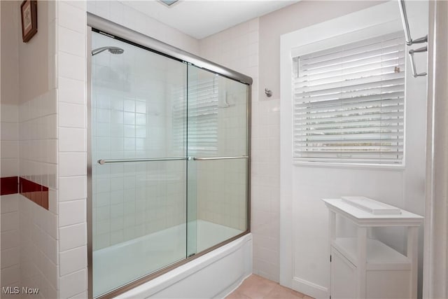 full bathroom featuring tile patterned flooring and enclosed tub / shower combo