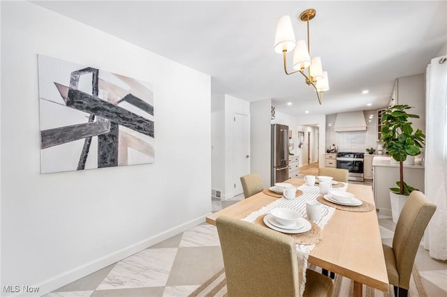 dining room featuring marble finish floor, baseboards, a notable chandelier, and recessed lighting