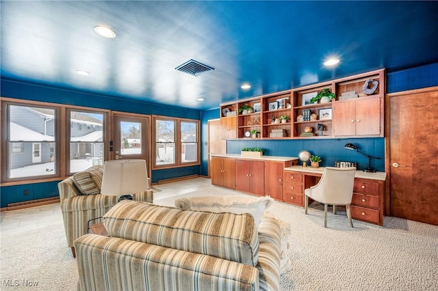 office with light carpet, visible vents, built in desk, and recessed lighting