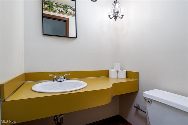 bathroom featuring toilet and a sink