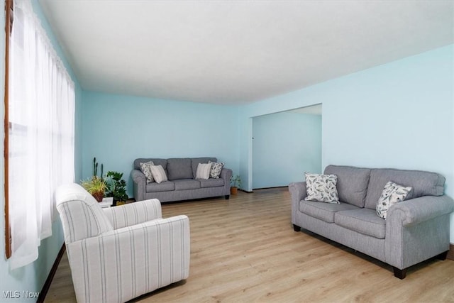 living area with light wood-style floors