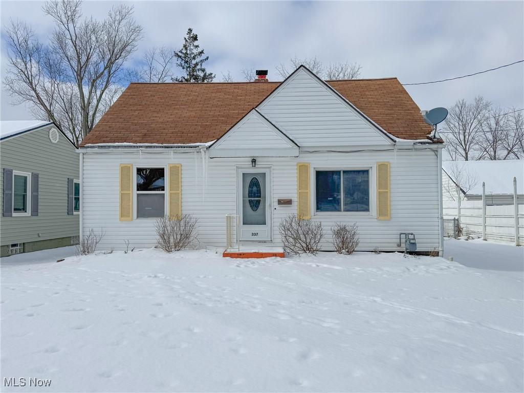 bungalow featuring a chimney