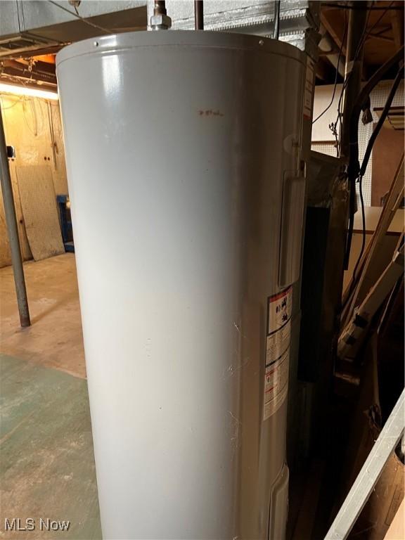 utility room with electric water heater