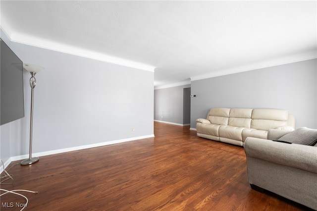 unfurnished living room featuring crown molding, baseboards, and dark wood-style flooring