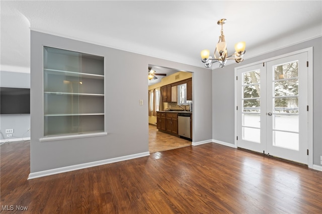 unfurnished dining area featuring dark wood-style flooring, french doors, and baseboards