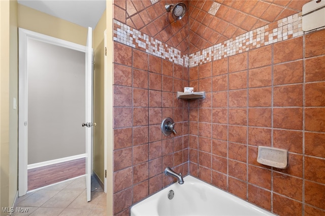 full bathroom featuring tile patterned flooring, shower / bathing tub combination, and baseboards