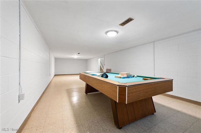 game room featuring visible vents, light floors, pool table, and concrete block wall