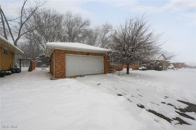 view of snow covered garage