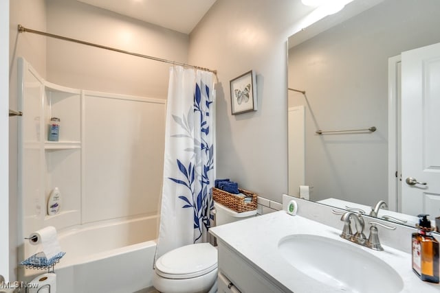 bathroom with toilet, shower / tub combo, and vanity