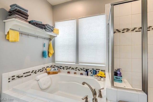 full bathroom featuring a garden tub