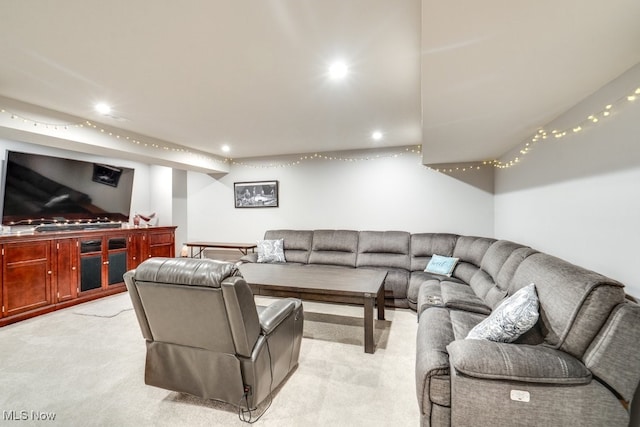 living room with light carpet and recessed lighting