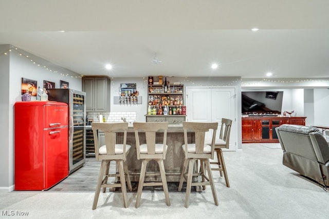 bar with a bar, decorative backsplash, and recessed lighting