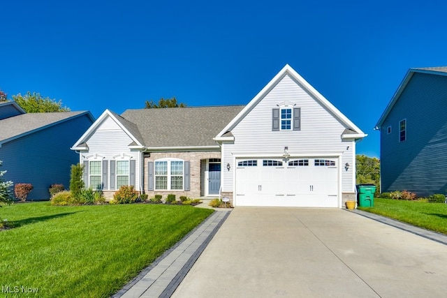 view of front of property featuring a garage, stone siding, a front lawn, and concrete driveway