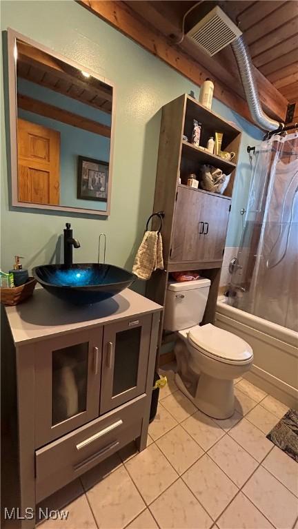 bathroom with shower / tub combo, visible vents, toilet, tile patterned flooring, and vanity