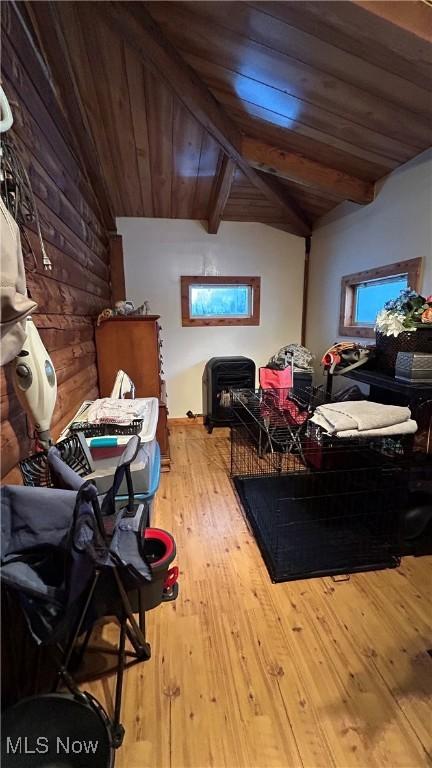 interior space featuring wood ceiling, vaulted ceiling with beams, and wood finished floors