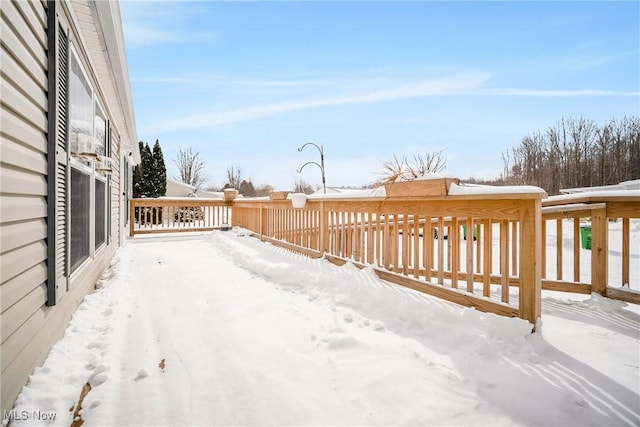view of snow covered deck