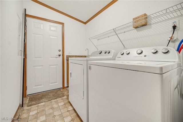 laundry room with crown molding, laundry area, and independent washer and dryer